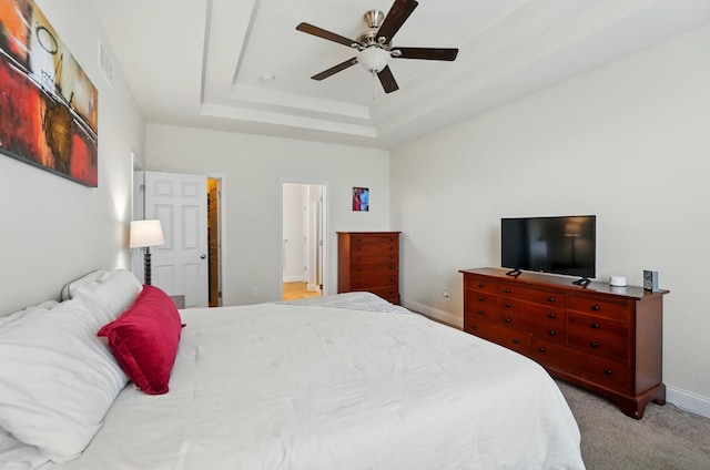 1344 Wilshire Ct, Union, KY 41091 - carpeted bedroom with a tray ceiling, baseboards, ceiling fan, and ensuite bathroom