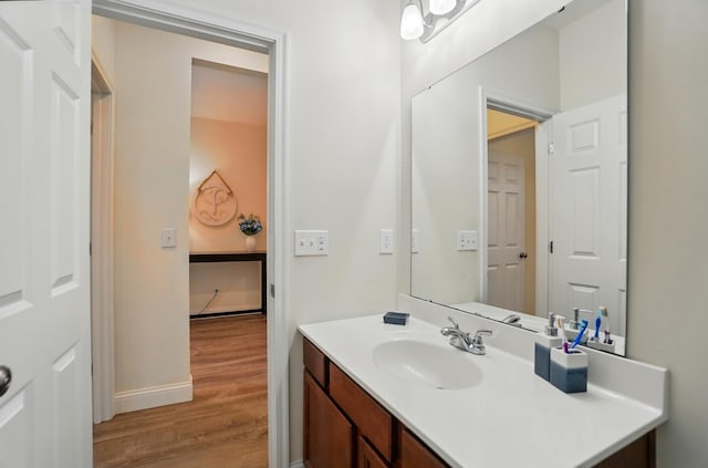 1344 Wilshire Ct, Union, KY 41091 - bathroom with wood finished floors, vanity, and baseboards