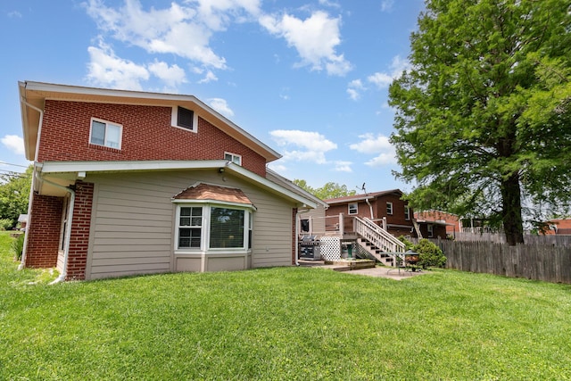 10 Juarez Cir, Covington, KY 41017 - rear view of property featuring brick siding, a deck, and stairway