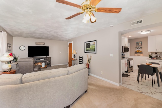 10 Juarez Cir, Covington, KY 41017 - living room with ceiling fan, baseboards, and light marble finish floors