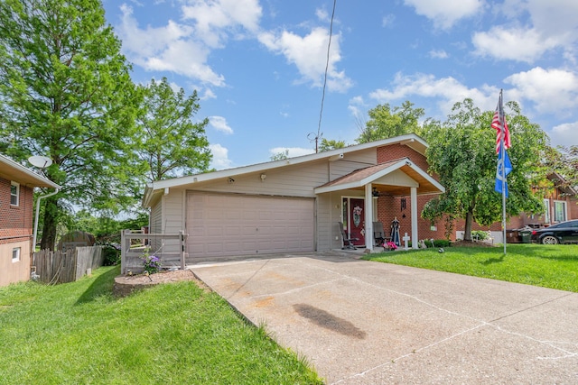 10 Juarez Cir, Covington, KY 41017 - view of front facade featuring driveway, an attached garage, and brick siding