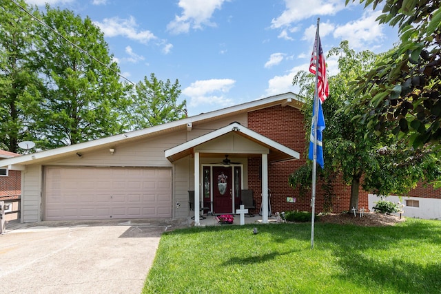 10 Juarez Cir, Covington, KY 41017 - view of front facade featuring concrete driveway, a front yard, a garage, and brick siding