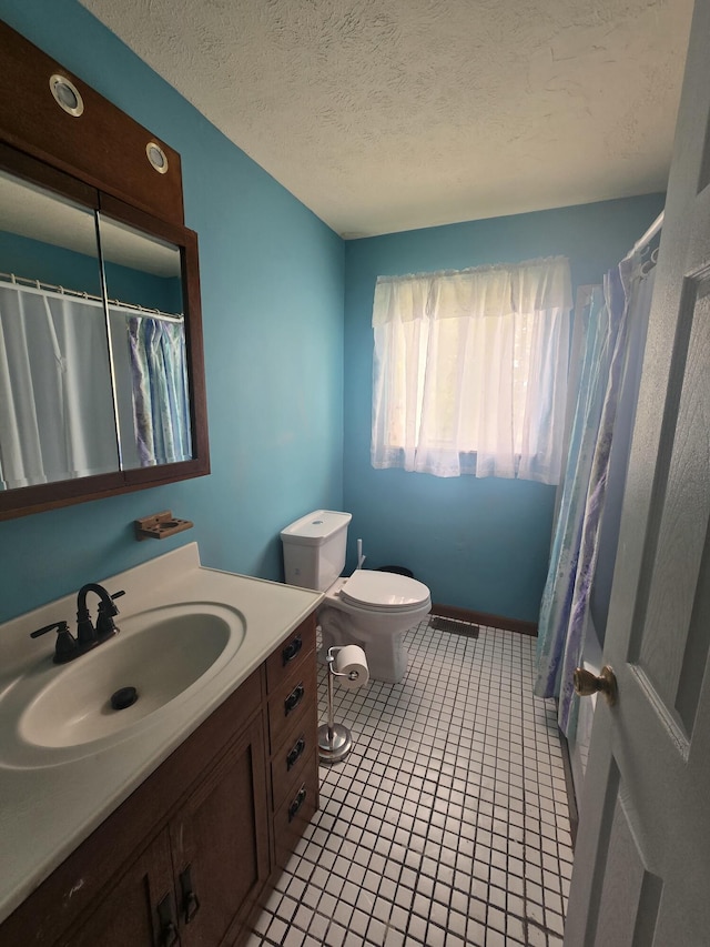 438 Ky Highway 455, Sparta, KY 41086 - bathroom with vanity, toilet, tile patterned floors, curtained shower, and a textured ceiling