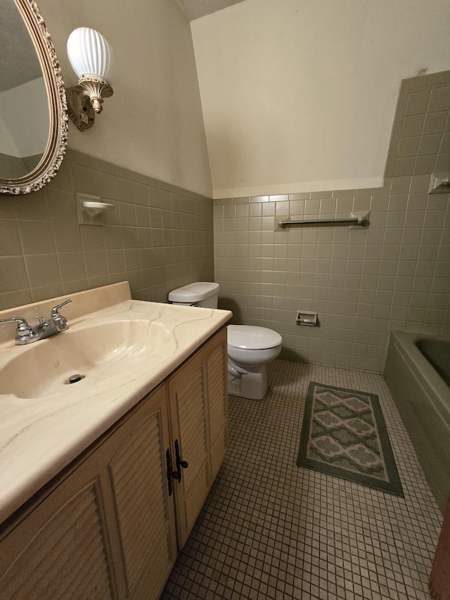 438 Ky Highway 455, Sparta, KY 41086 - full bath featuring vanity, wainscoting, toilet, tile walls, and tile patterned floors