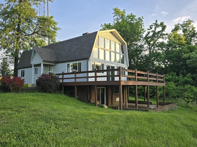 438 Ky Highway 455, Sparta, KY 41086 - back of house with roof with shingles, a deck, and a lawn