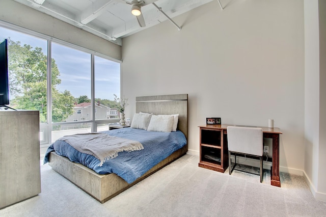 120 Main St Unit 205, Newport, KY 41071 - bedroom featuring carpet flooring, beamed ceiling, a ceiling fan, a towering ceiling, and baseboards