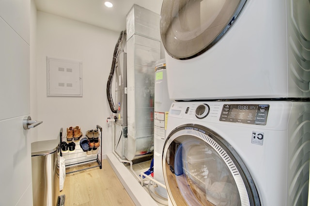 120 Main St Unit 205, Newport, KY 41071 - laundry area with stacked washer / drying machine, wood finished floors, recessed lighting, and electric panel