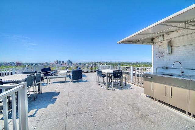 120 Main St Unit 205, Newport, KY 41071 - view of patio / terrace featuring a sink, outdoor dining space, and a view of city