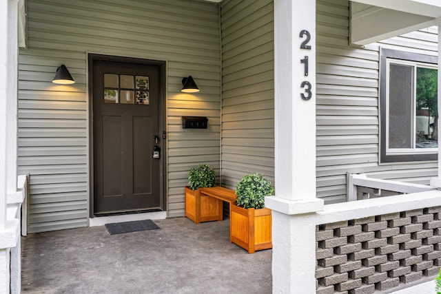 213 8th Ave, Dayton, KY 41074 - view of exterior entry featuring a porch