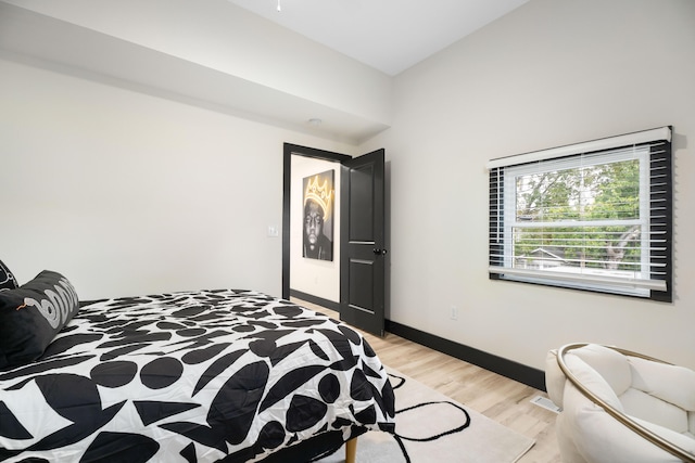 213 8th Ave, Dayton, KY 41074 - bedroom with light wood-style floors and baseboards