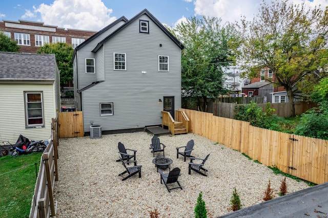 213 8th Ave, Dayton, KY 41074 - back of property featuring a fire pit, a gate, a fenced backyard, and central AC unit