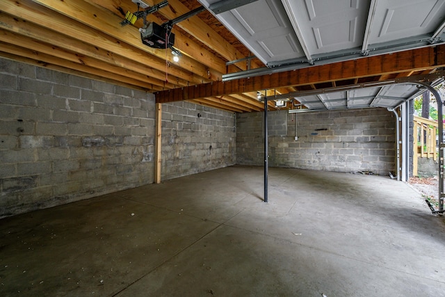 213 8th Ave, Dayton, KY 41074 - garage with a garage door opener and concrete block wall