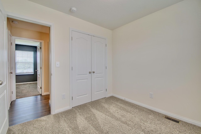 609 Crosswinds Pointe Ct, Walton, KY 41094 - unfurnished bedroom with carpet flooring, baseboards, and a closet