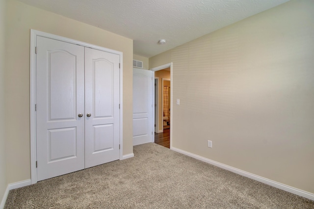 609 Crosswinds Pointe Ct, Walton, KY 41094 - unfurnished bedroom with carpet, baseboards, a closet, and a textured ceiling