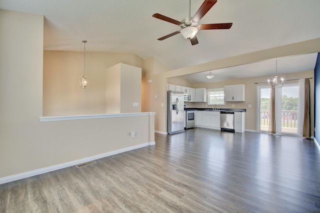 609 Crosswinds Pointe Ct, Walton, KY 41094 - unfurnished living room featuring lofted ceiling, wood finished floors, ceiling fan, a chandelier, and baseboards