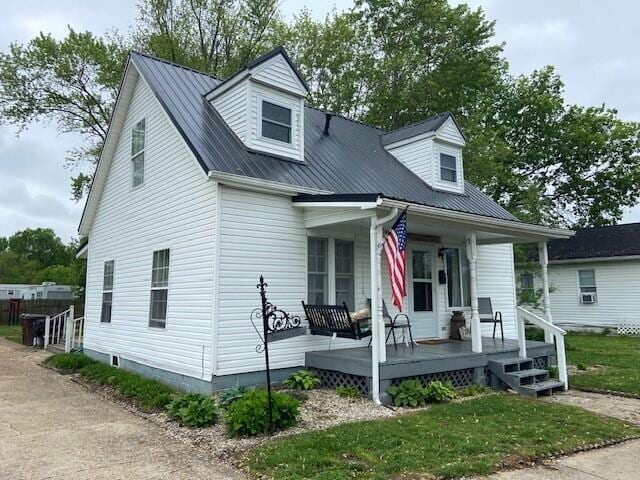 630 E 2nd St, Augusta, KY 41002 - cape cod home with covered porch and metal roof