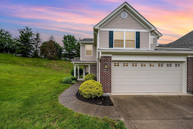 874 Borderlands Dr, Erlanger, KY 41018 - traditional-style home featuring brick siding, concrete driveway, a yard, roof with shingles, and a garage