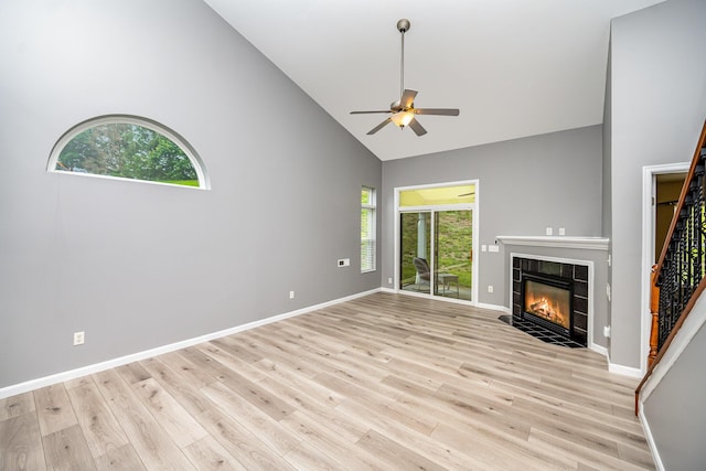 874 Borderlands Dr, Erlanger, KY 41018 - unfurnished living room featuring high vaulted ceiling, a ceiling fan, healthy amount of natural light, a tile fireplace, and light wood finished floors