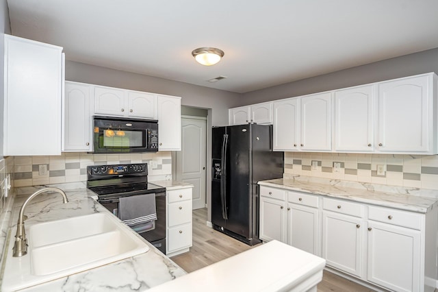 874 Borderlands Dr, Erlanger, KY 41018 - kitchen featuring black appliances, a sink, decorative backsplash, white cabinetry, and light stone counters