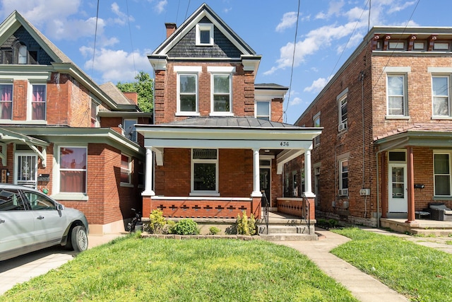 436 Elm St, Ludlow, KY 41016 - view of property with covered porch, brick siding, a front lawn, and a chimney