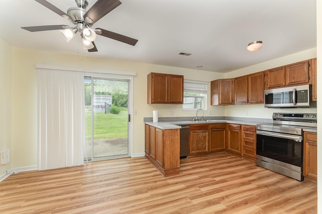 5332 Country Club Ln Unit 5C, Burlington, KY 41005 - kitchen with stainless steel appliances, brown cabinets, and light countertops