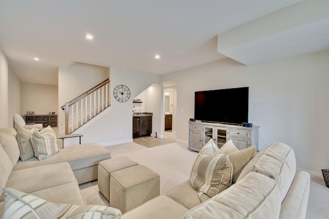 3942 Brunswick Ct, Erlanger, KY 41018 - living room featuring light colored carpet, baseboards, stairs, and recessed lighting