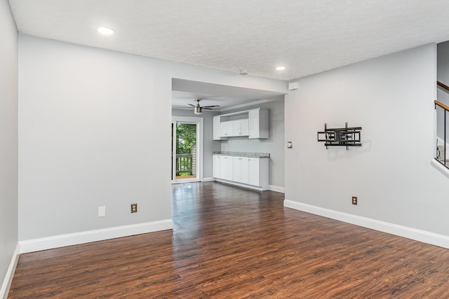 2862 Cliffview Ct, Villa Hills, KY 41017 - unfurnished living room featuring dark wood-style floors, baseboards, ceiling fan, recessed lighting, and a textured ceiling