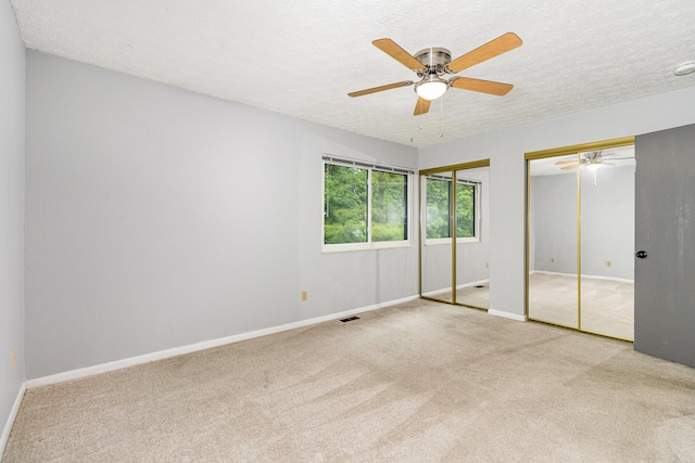 2862 Cliffview Ct, Villa Hills, KY 41017 - unfurnished bedroom featuring carpet floors, a textured ceiling, two closets, and baseboards