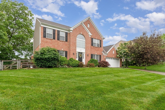 4049 Sherbourne Dr, Independence, KY 41051 - colonial house featuring brick siding, an attached garage, and driveway