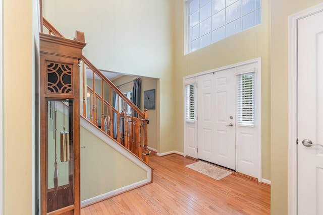 4049 Sherbourne Dr, Independence, KY 41051 - entrance foyer featuring wood-type flooring, stairs, a high ceiling, and baseboards