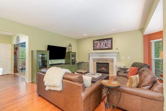 4049 Sherbourne Dr, Independence, KY 41051 - living area with light wood-style flooring, a tiled fireplace, recessed lighting, and baseboards