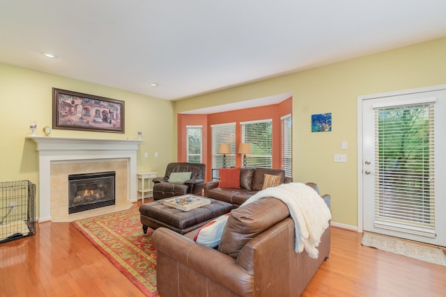 4049 Sherbourne Dr, Independence, KY 41051 - living room featuring light wood-style floors, a tile fireplace, recessed lighting, and baseboards