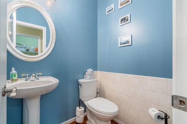 4049 Sherbourne Dr, Independence, KY 41051 - half bathroom with toilet and tile walls