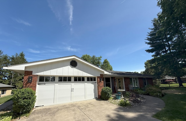 113 Vernon Dr, Fort Mitchell, KY 41017 - single story home with brick siding, an attached garage, driveway, and board and batten siding