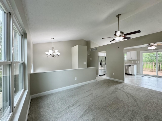 1039 Meadowbrook Ct, Hebron, KY 41048 - unfurnished living room with vaulted ceiling, baseboards, a chandelier, light carpet, and a ceiling fan