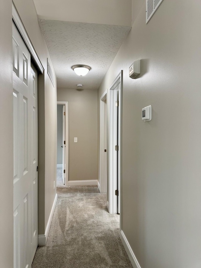 1039 Meadowbrook Ct, Hebron, KY 41048 - hall with carpet floors, baseboards, and a textured ceiling