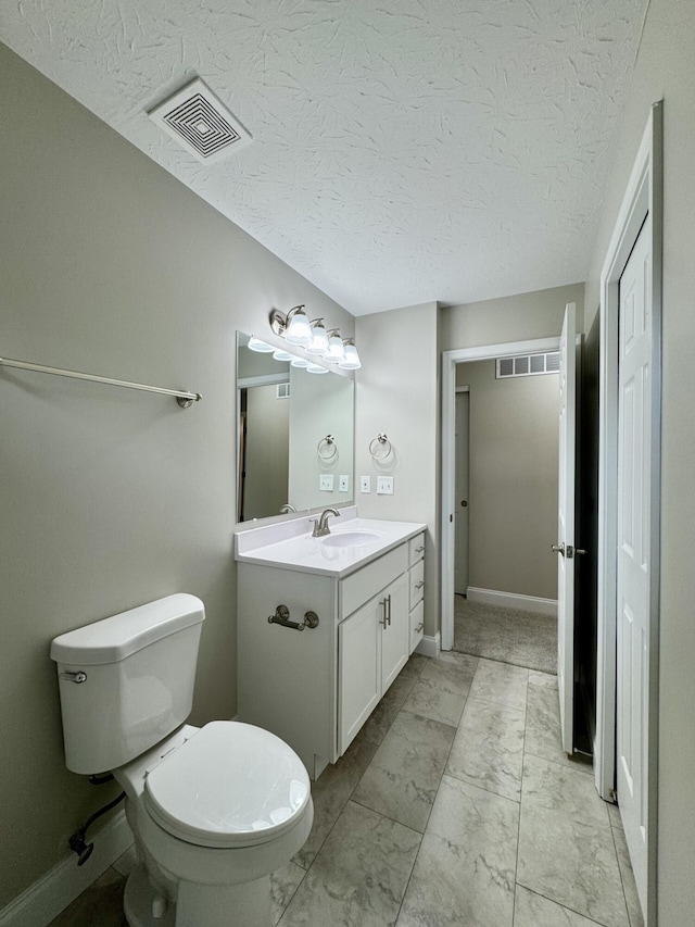 1039 Meadowbrook Ct, Hebron, KY 41048 - bathroom with vanity, toilet, a textured ceiling, marble look tiles, and baseboards