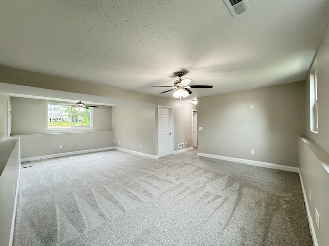 1039 Meadowbrook Ct, Hebron, KY 41048 - spare room featuring ceiling fan, baseboards, light colored carpet, and a textured ceiling