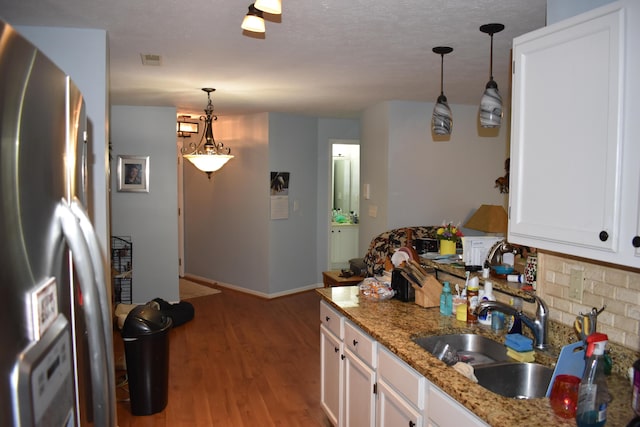 185 Cave Run Dr Unit 5, Erlanger, KY 41018 - kitchen with stainless steel fridge, a sink, light wood-type flooring, white cabinets, and light stone countertops