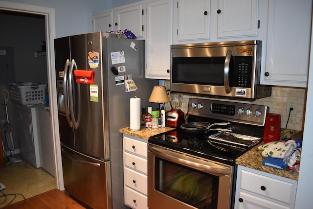185 Cave Run Dr Unit 5, Erlanger, KY 41018 - kitchen with stainless steel appliances, backsplash, and white cabinetry