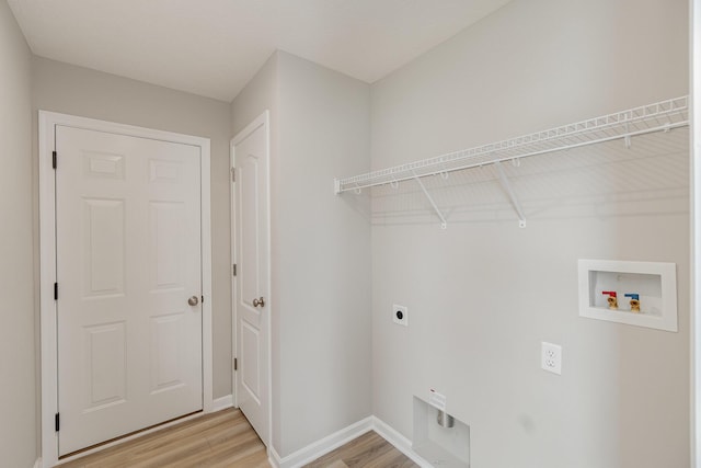 2535 Crosshill Dr, Crescent Springs, KY 41017 - laundry area with hookup for an electric dryer, light wood finished floors, hookup for a washing machine, and baseboards