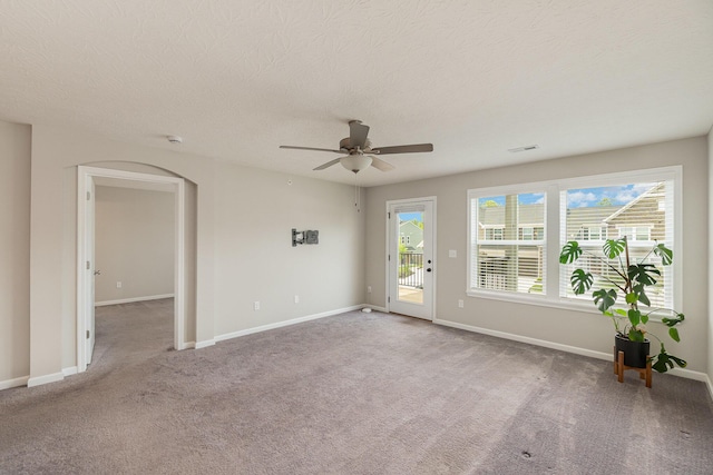 2535 Crosshill Dr, Crescent Springs, KY 41017 - unfurnished room featuring arched walkways, carpet floors, a ceiling fan, baseboards, and a textured ceiling
