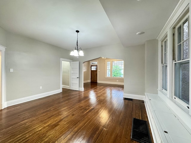 618 E 2nd St, Newport, KY 41071 - empty room with wood-type flooring, baseboards, arched walkways, and a chandelier
