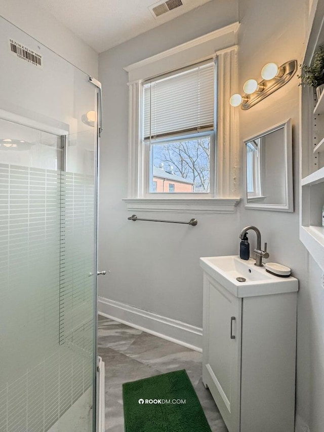 1816 Scott St, Covington, KY 41014 - full bathroom featuring vanity, a shower stall, baseboards, and marble look tile flooring