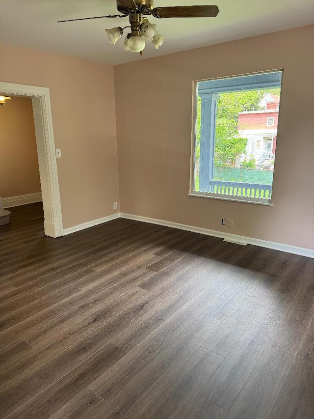 1148 Park Ave, Newport, KY 41071 - unfurnished room featuring dark wood-type flooring, a ceiling fan, and baseboards
