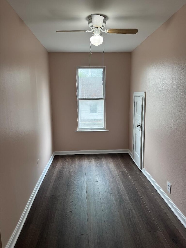1148 Park Ave, Newport, KY 41071 - empty room with dark wood-type flooring, ceiling fan, and baseboards