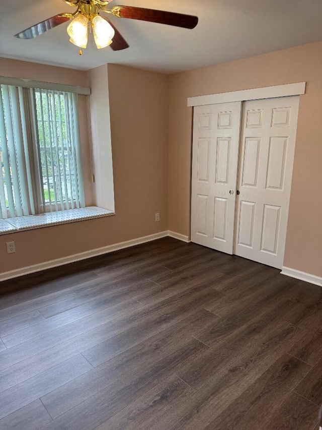 1148 Park Ave, Newport, KY 41071 - unfurnished bedroom with dark wood finished floors, baseboards, a closet, and ceiling fan