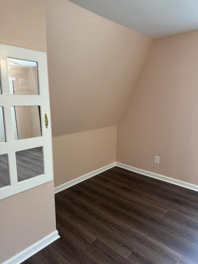 1148 Park Ave, Newport, KY 41071 - additional living space with dark wood-style floors, vaulted ceiling, and baseboards