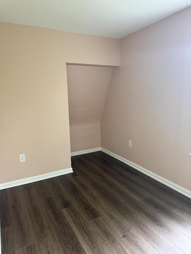 1148 Park Ave, Newport, KY 41071 - unfurnished room featuring dark wood finished floors, baseboards, and lofted ceiling