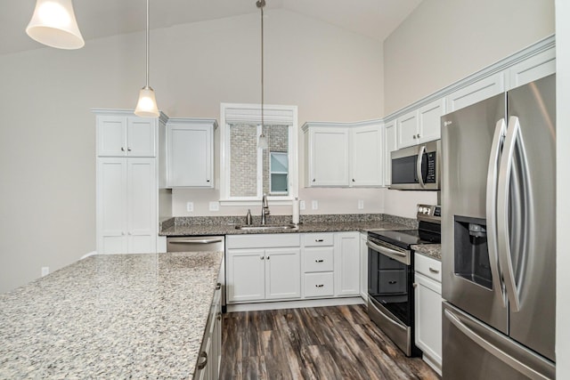 1739 Barons Cv, Hebron, KY 41048 - kitchen with stainless steel appliances, a sink, high vaulted ceiling, white cabinetry, and dark wood finished floors